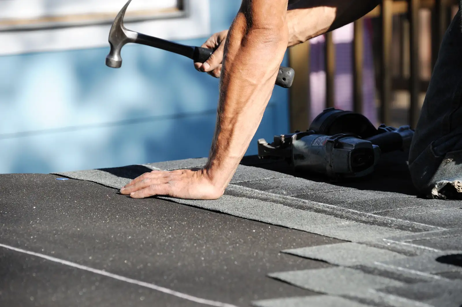 Roofer at work on a roof
